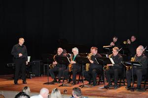 Tom Hornbaker, playing saxaphone on the left. 